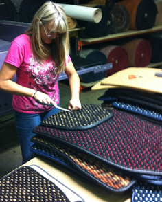 CocoMats.com Employee Diana cleaning the coco mats prior to heel pads going on.